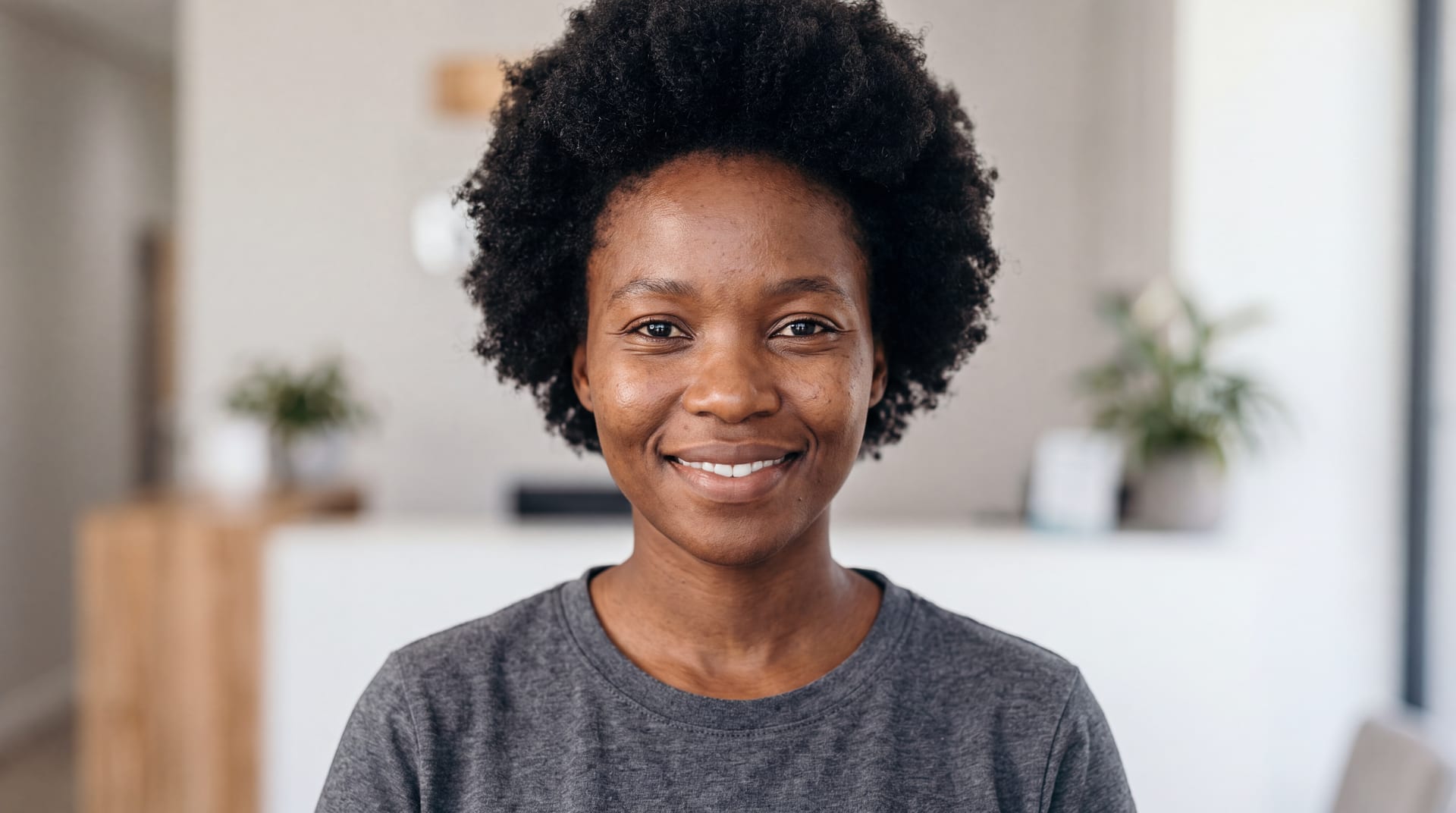 South African woman in natural light, looking directly at the camera